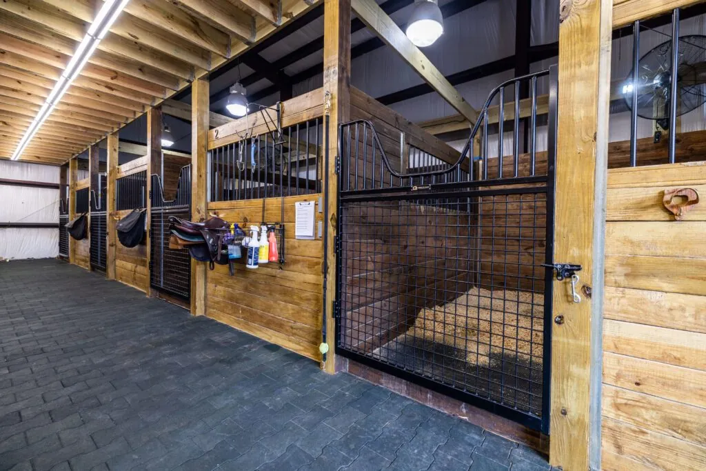 Indoor horse stalls with hurricane-proof roofing and automatic waterers